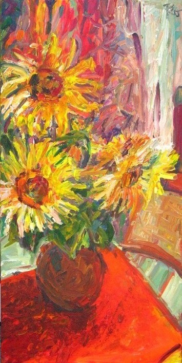 Sonnenblumen  auf rotem Tisch